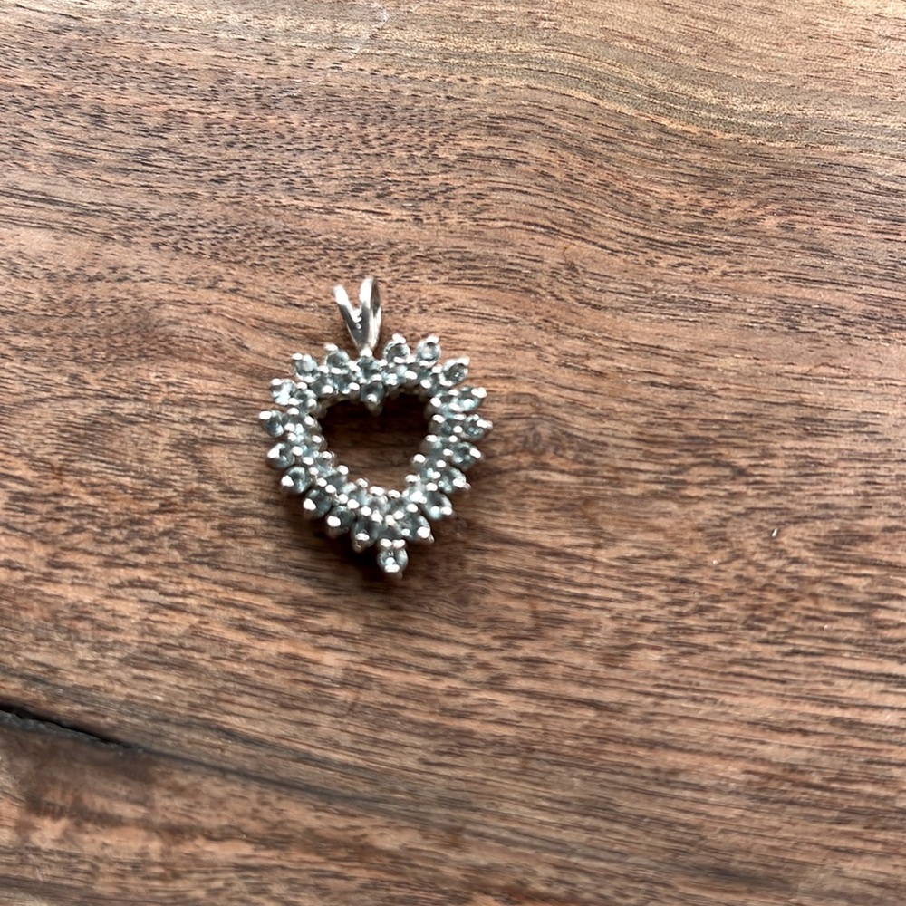 Sterling silver, heart-shaped blue topaz charm for necklace.
